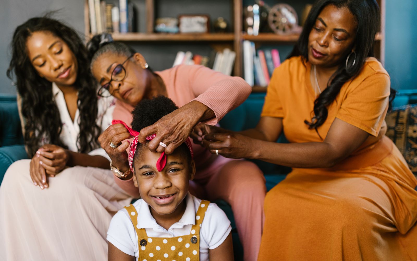 Three generations of a family together, relaxed and happy